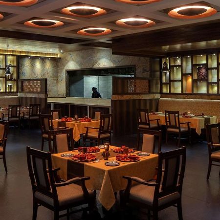Radisson Blu Plaza Hotel Mysore Exteriör bild Interior of a restaurant in India