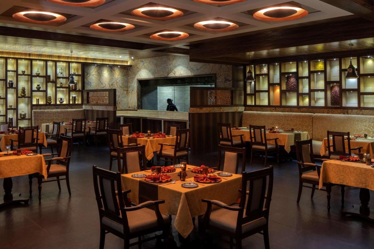 Radisson Blu Plaza Hotel Mysore Exteriör bild Interior of a restaurant in India